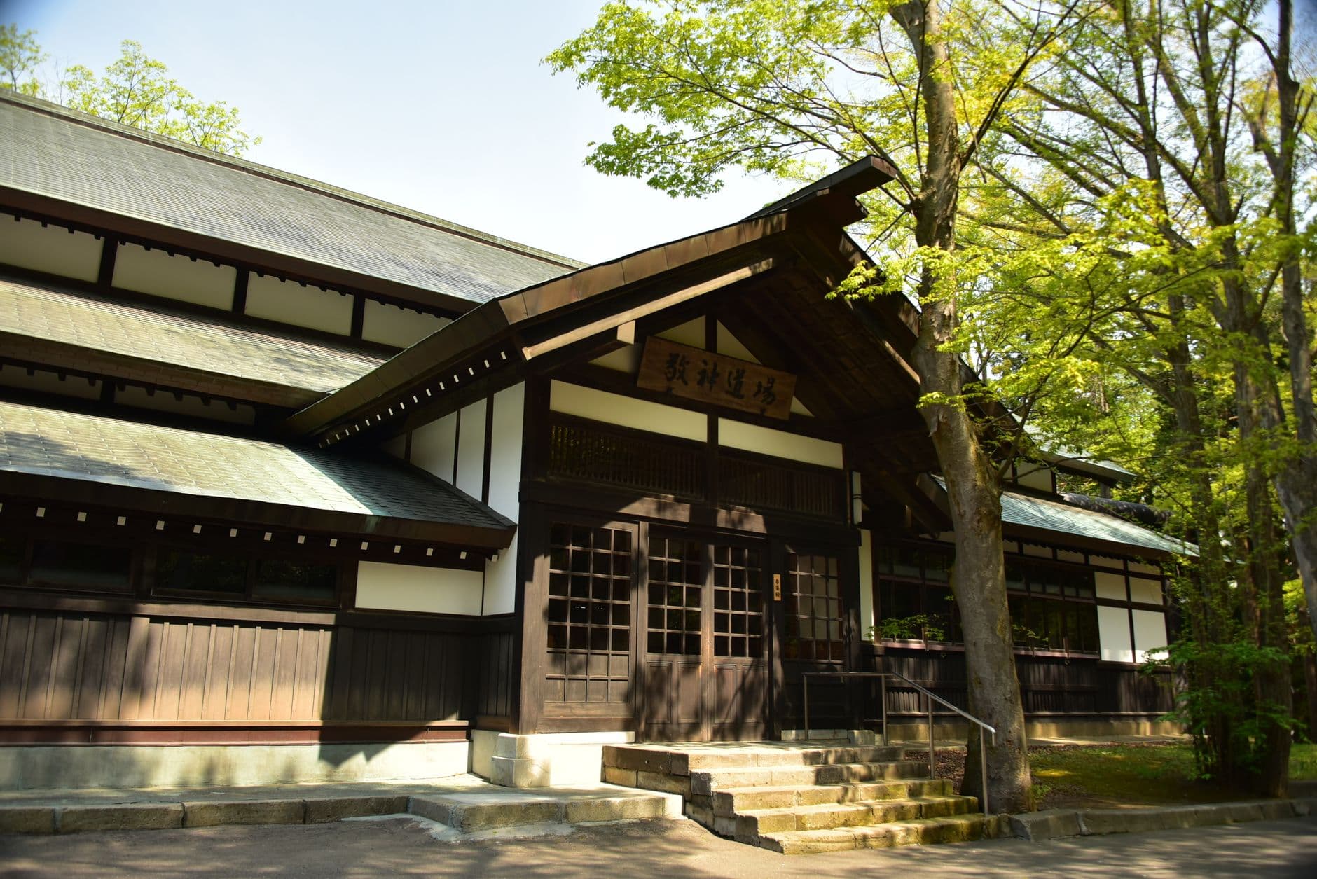 Beautiful traditional Japanese temple with wooden architecture and lush greenery.